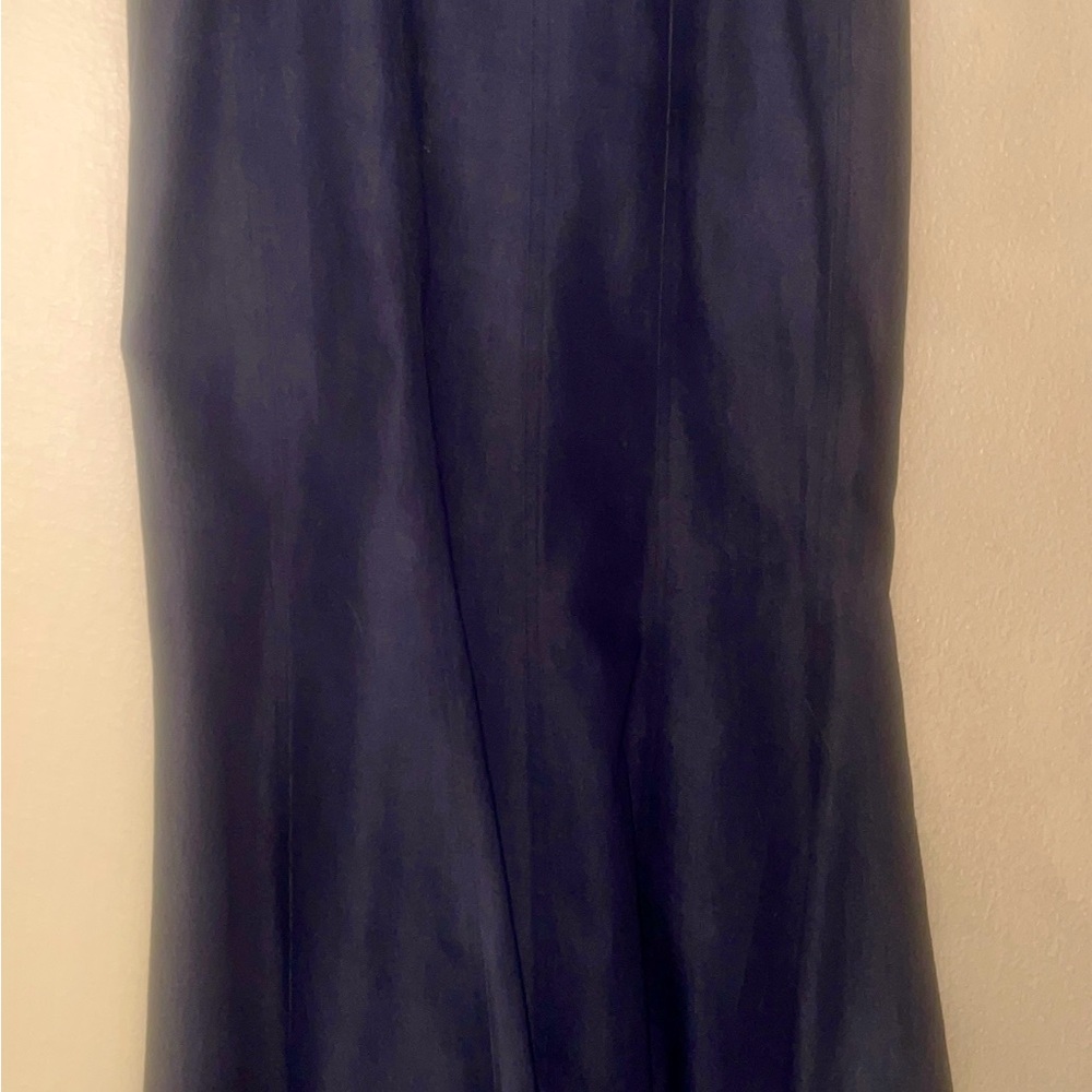 Beautiful tight fitting denim skirt with a flare at the bottom brand